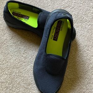 Skechers go walk slip on shoes with textured navy/black uppers.